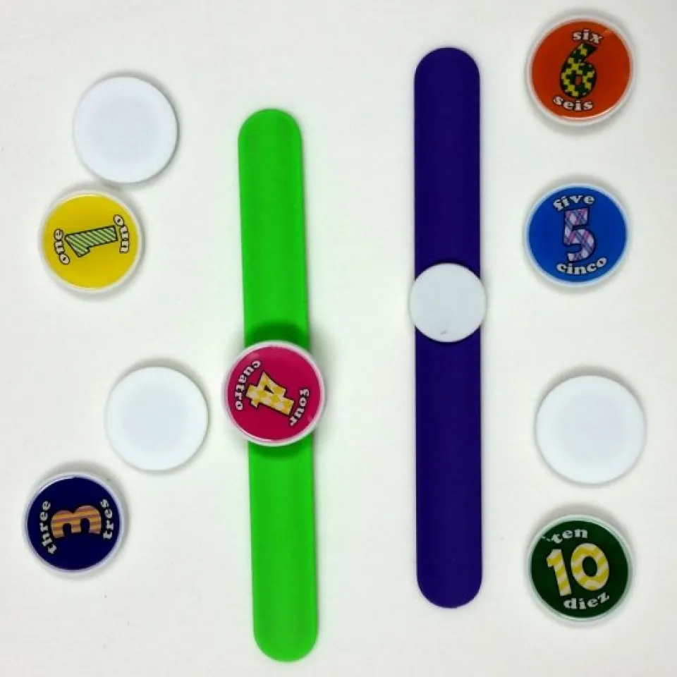 slap bracelet with interchangeable tokens and straps of different colors slap bracelet with interchangeable tokens and straps of different colors